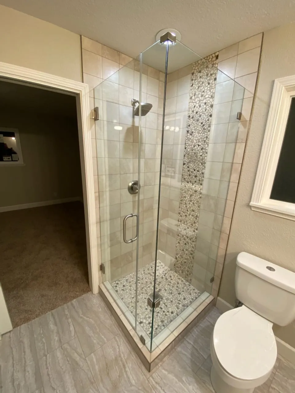 Pebble-Floor Shower & Double Vanities by PrimeSpec Construction — photo 2 of 5