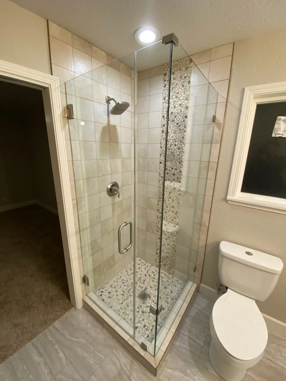 Pebble-Floor Shower & Double Vanities by PrimeSpec Construction — photo 3 of 5