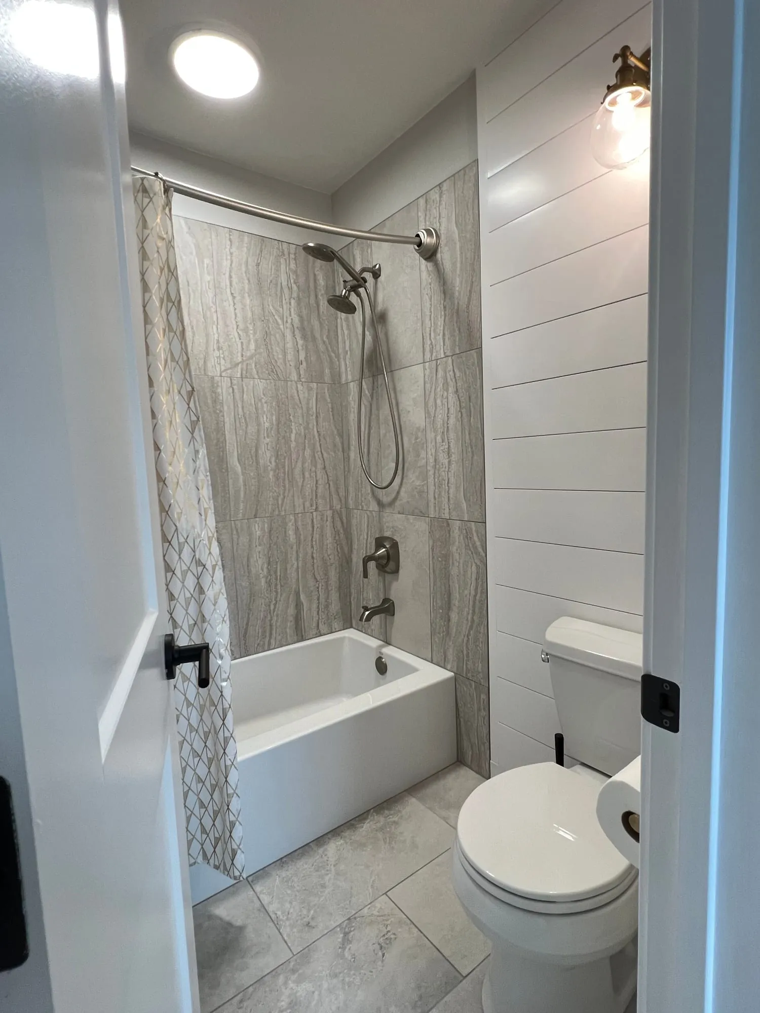 Tub-Shower with Shiplap Walls by PrimeSpec Construction — photo 1 of 1