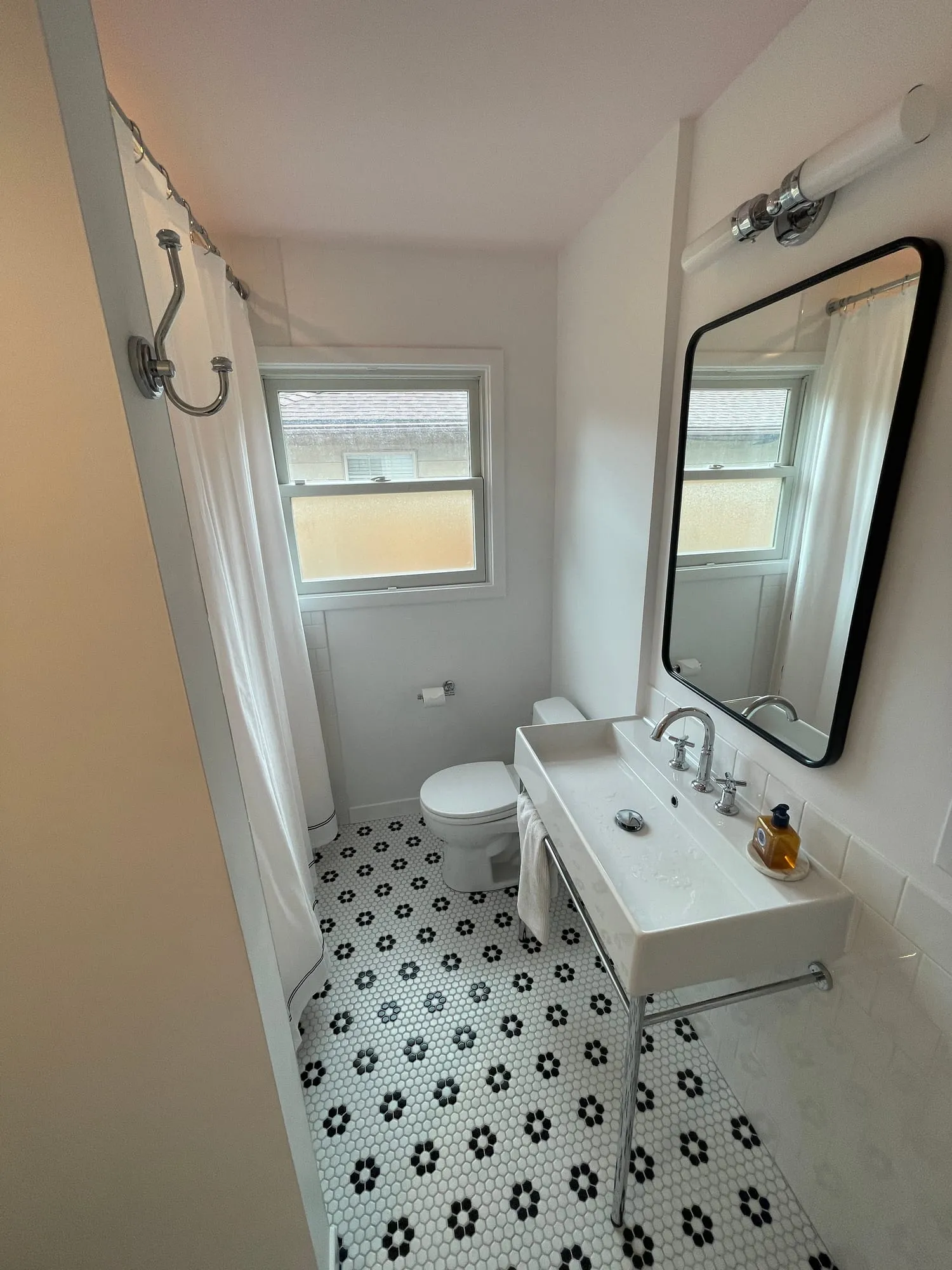 Black & White Hall Bath by PrimeSpec Construction — photo 2 of 4