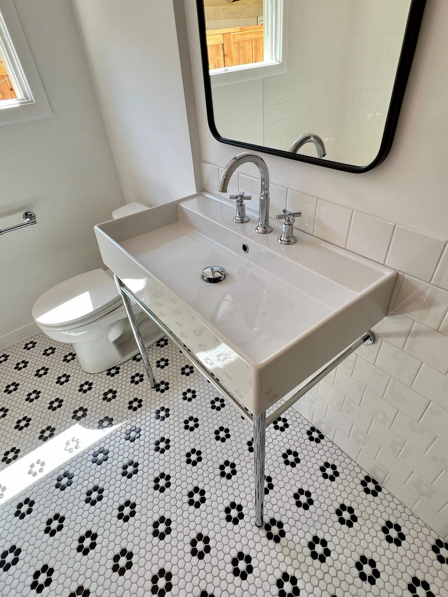 Black & White Hall Bath by PrimeSpec Construction — photo 1 of 4