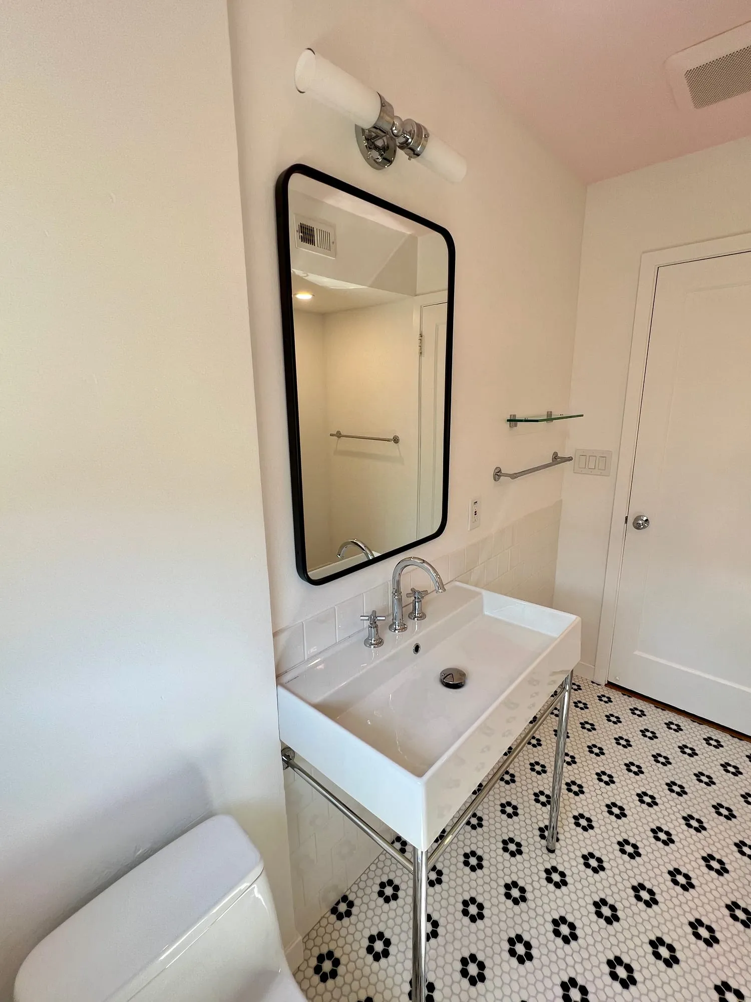 Black & White Hall Bath by PrimeSpec Construction — photo 4 of 4