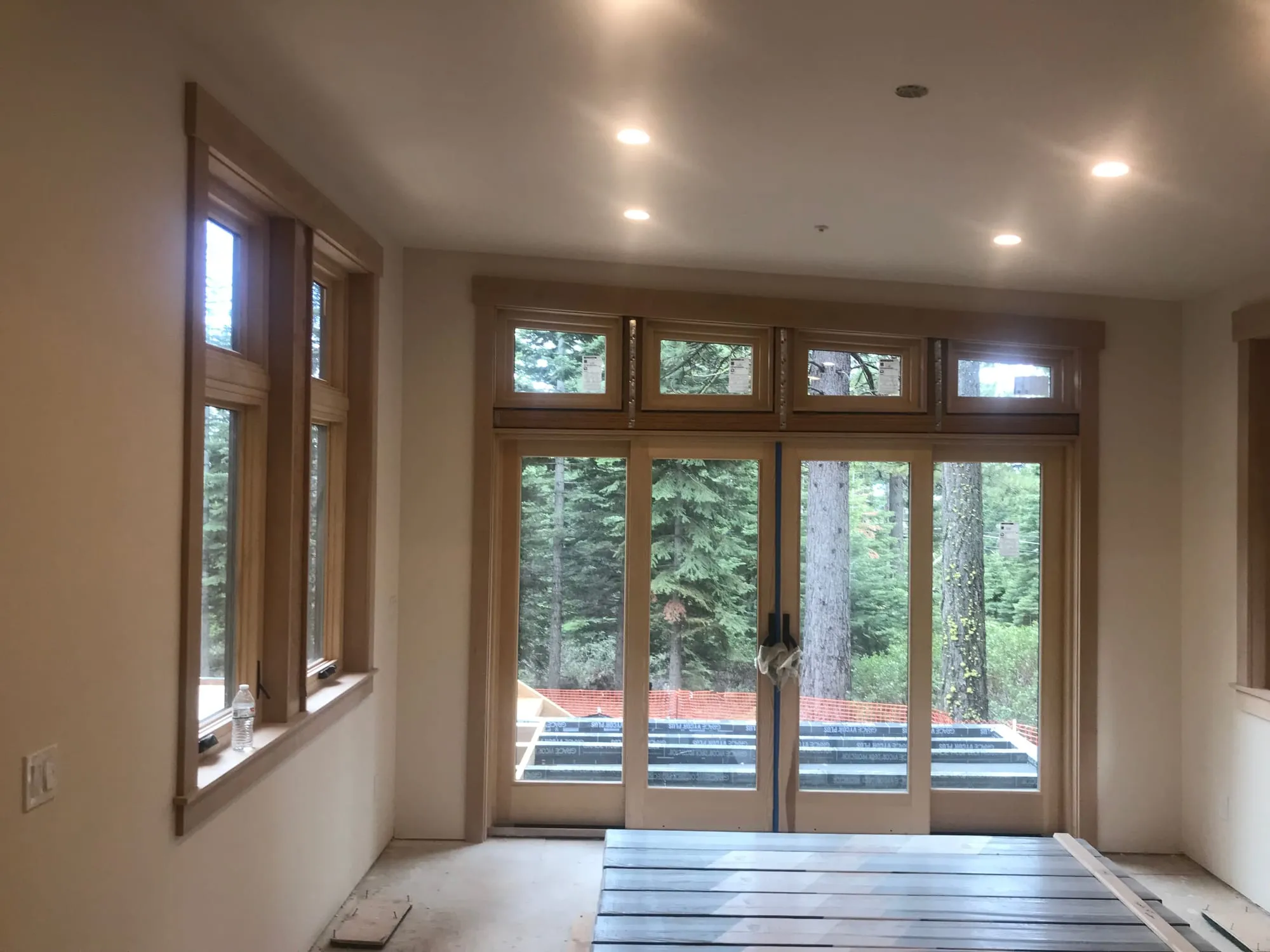 Wood-Trimmed Great Room by PrimeSpec Construction — photo 1 of 3