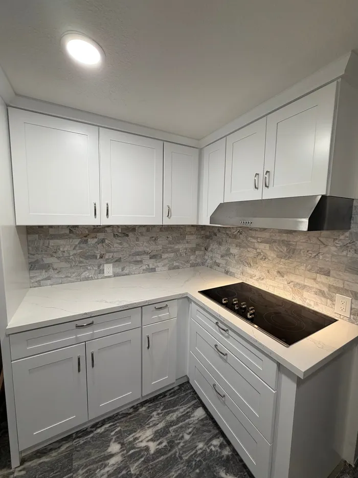 White Kitchen Remodel by Primespec Construction project photo