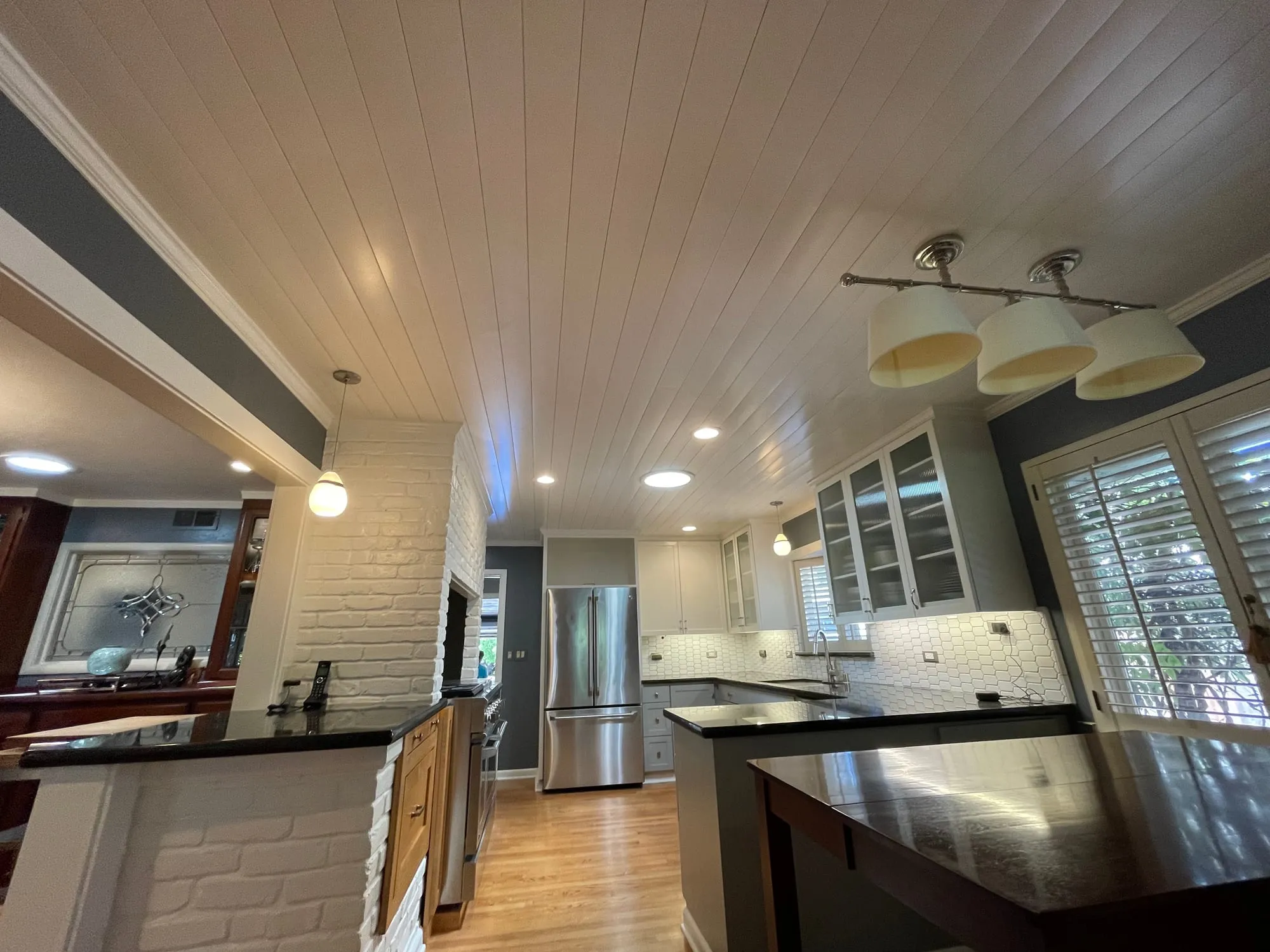 Kitchen with Shiplap Ceiling by PrimeSpec Construction — photo 1 of 1