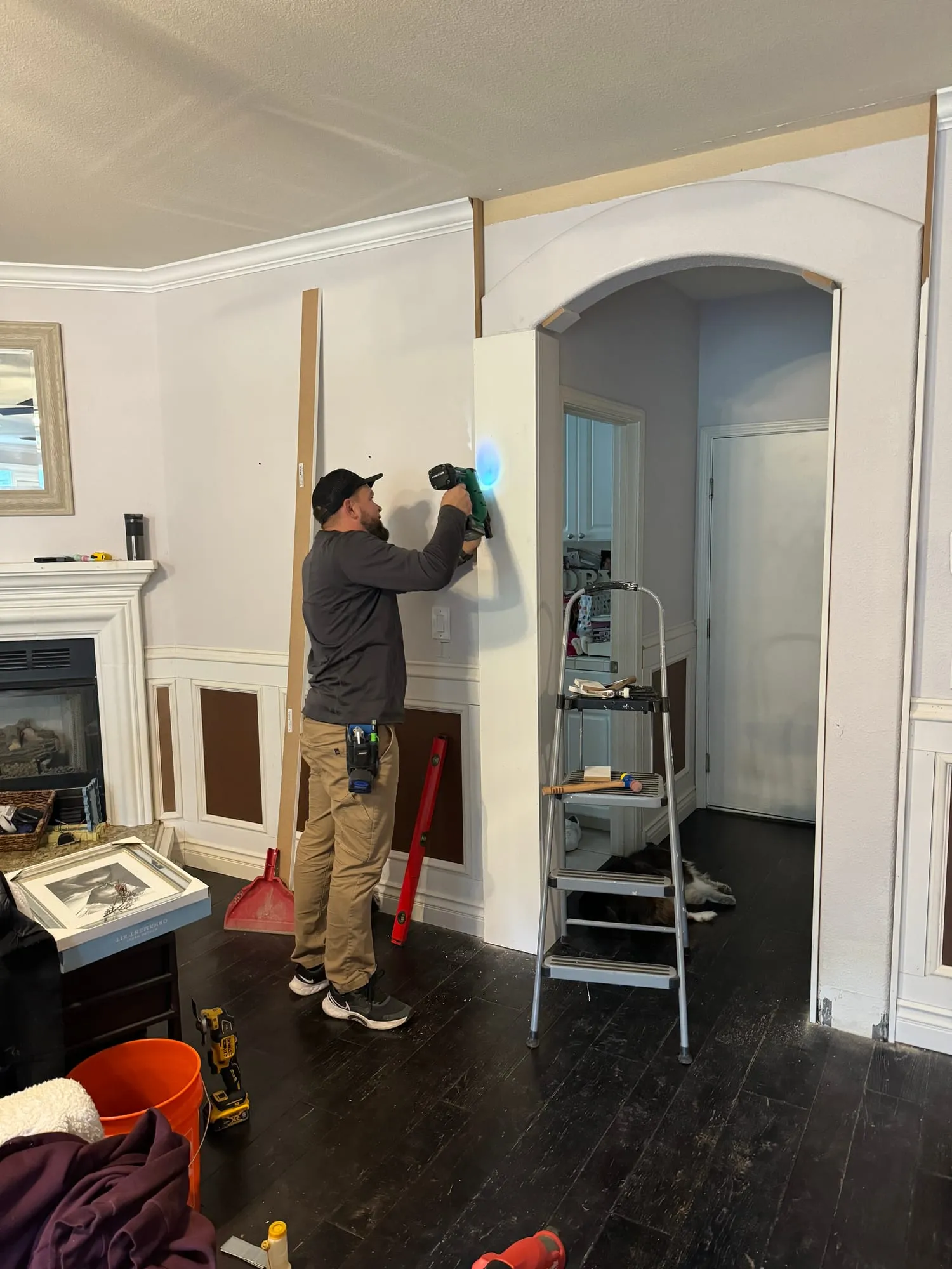 PrimeSpec crew installing trim around a fireplace