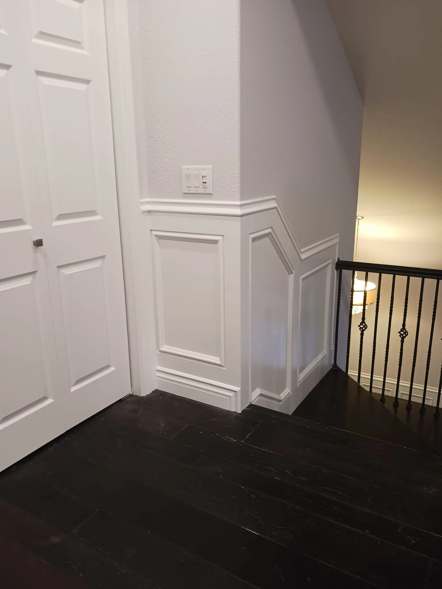 Wainscoted Staircase & Landing by PrimeSpec Construction — photo 7 of 10