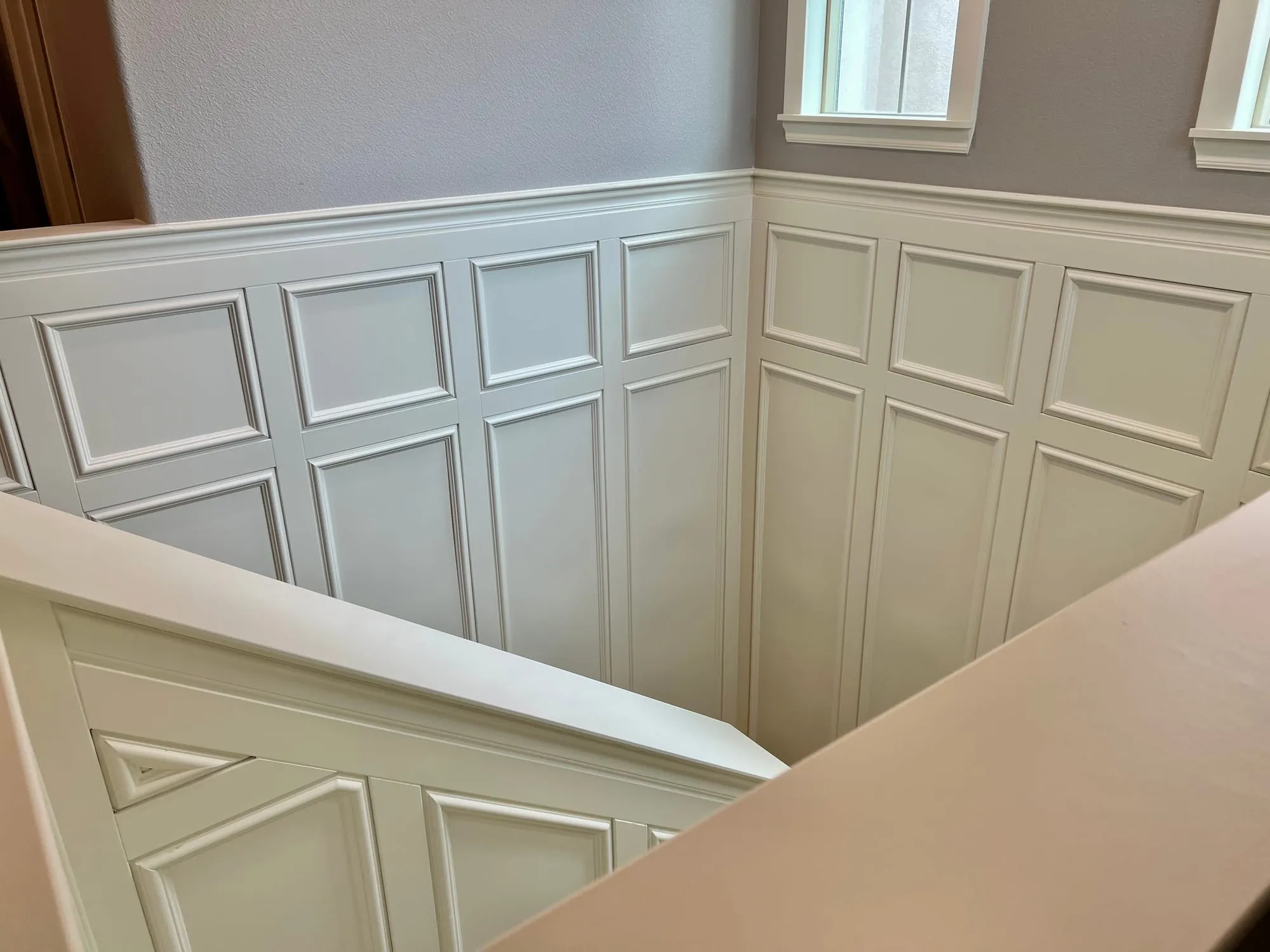 Wainscoted Staircase & Landing by PrimeSpec Construction — photo 9 of 10