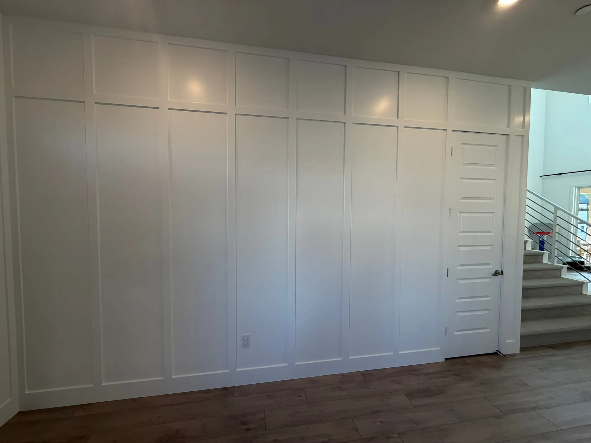 Full-Height Entryway Paneling by PrimeSpec Construction — photo 2 of 3
