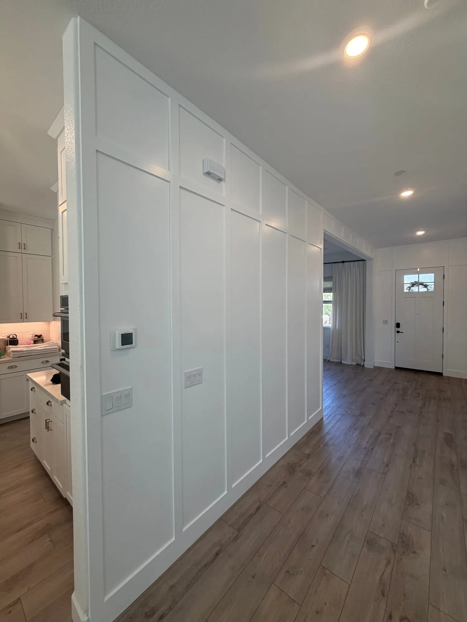 Full-Height Entryway Paneling by PrimeSpec Construction — photo 3 of 3