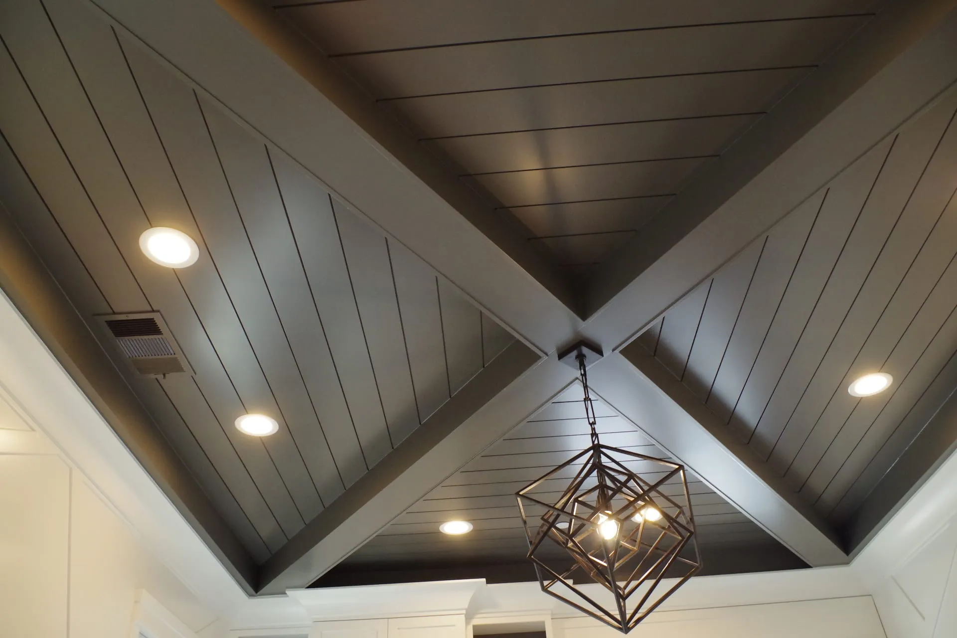 Bedroom with Dark Shiplap Ceiling by PrimeSpec Construction — photo 3 of 5