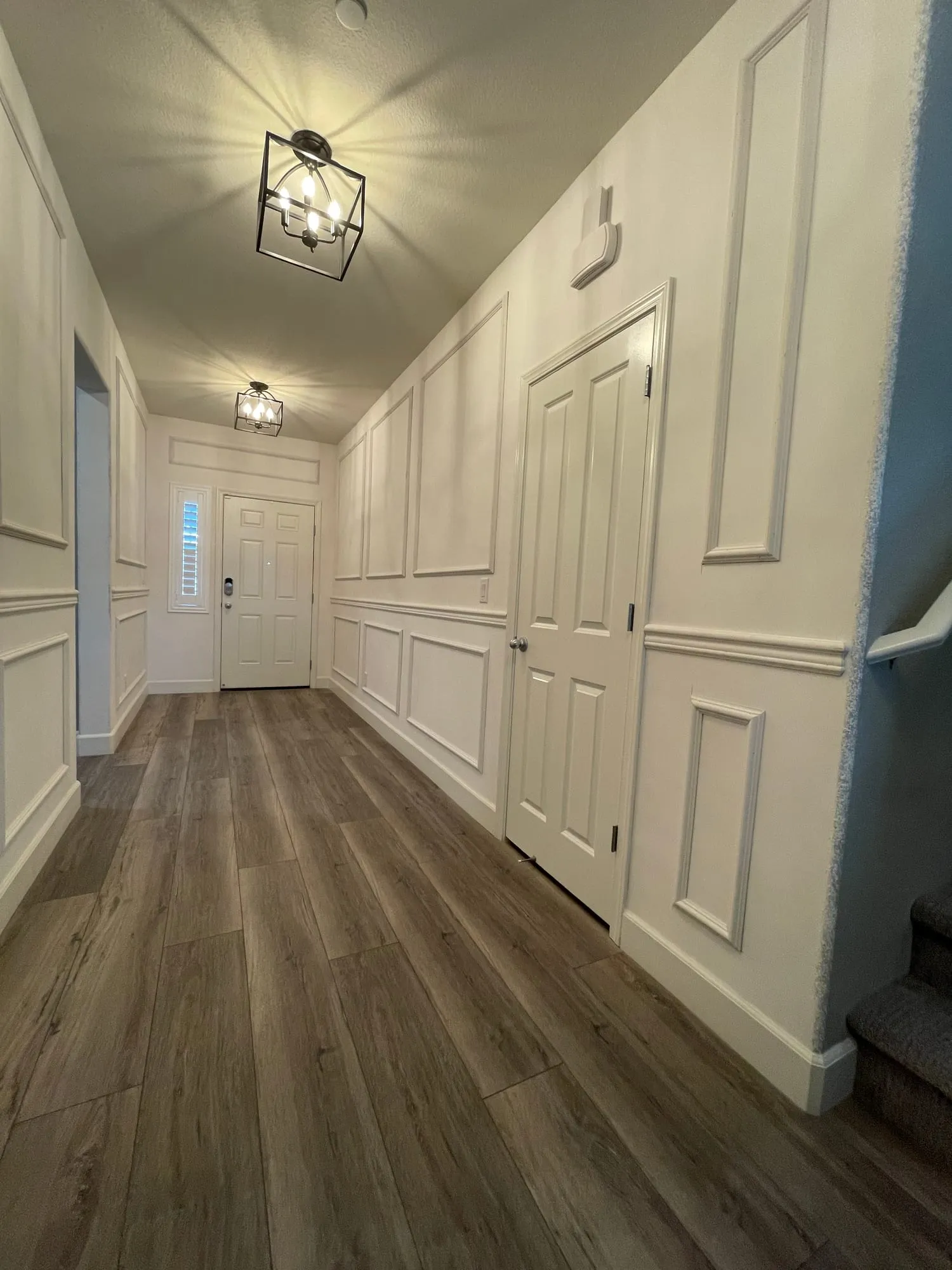Picture-Frame Molding Hallway by PrimeSpec Construction — photo 2 of 3